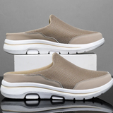 Chaussures mules sneakers BROOKVALE Olyndra London en cuir noir avec semelle blanche, vue de face.