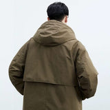Manteau Kensington Olyndra London en laine gris, vue de face avec col cheminée et boutons élégants.
