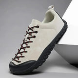 Basket Arden de course Olyndra London, sneakers blanches avec détails bleus, semelle en caoutchouc, style sportif et moderne.