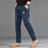 Pantalon jean utilitaire Hardland de Olyndra London, en denim robuste avec poches pratiques et coupe décontractée.