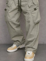 Pantalon utilitaire George de la marque Olyndra London, vêtement pratique avec poches multiples, couleur gris foncé.