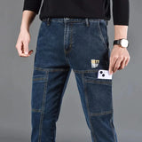 Jeans utilitaire Hardland de Olyndra London, pantalon robuste avec plusieurs poches, porté par un mannequin.