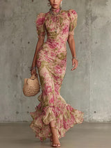 Robe longue vintage à imprimé rose, col montant avec volants et manches bouffantes, signée Olyndra London.