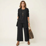Ensemble élégant 3 pièces de Olyndra London, costume sophistiqué avec veste, pantalon et blouse, en tissu chic et moderne.
