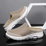 Baskets mules BROOKVALE de Olyndra London, chaussures décontractées en toile blanche avec semelle en caoutchouc visible.