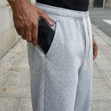 Pantalon cordon confort quotidien Olyndra London en tissu doux, coupe décontractée avec ceinture à cordon, couleur neutre.