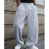 Pantalon cordon confort quotidien Olyndra London en tissu doux, coupe décontractée avec ceinture à cordon, couleur neutre.