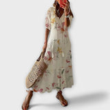 Robe maxi beige Olyndra London Serene avec coupe fluide et élégante, vue de face sur fond blanc.