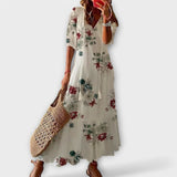 Robe longue SERENE MAXI blanche de Olyndra London, tissu fluide et élégant, portée en version blanche.